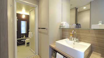 Separate tub and shower, free toiletries, hair dryer, slippers
