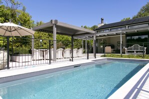 Seasonal outdoor pool, pool umbrellas, pool loungers