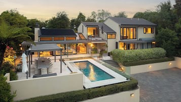 Seasonal outdoor pool, pool umbrellas, pool loungers