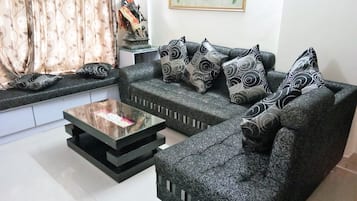 Two Bedroom Apartment with Airport Transfers | Living area | Flat-screen TV, pay films