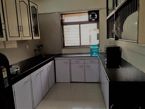 Two Bedroom Apartment with Airport Transfers | Private kitchen | Fridge, microwave, stovetop, coffee/tea maker