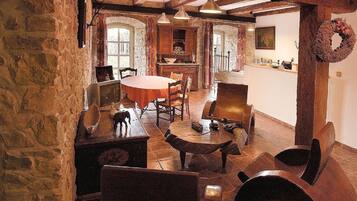 Deluxe Apartment, Garden View | Living area | TV