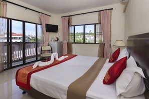 Deluxe Monthly Room | Minibar, in-room safe, individually decorated, individually furnished
