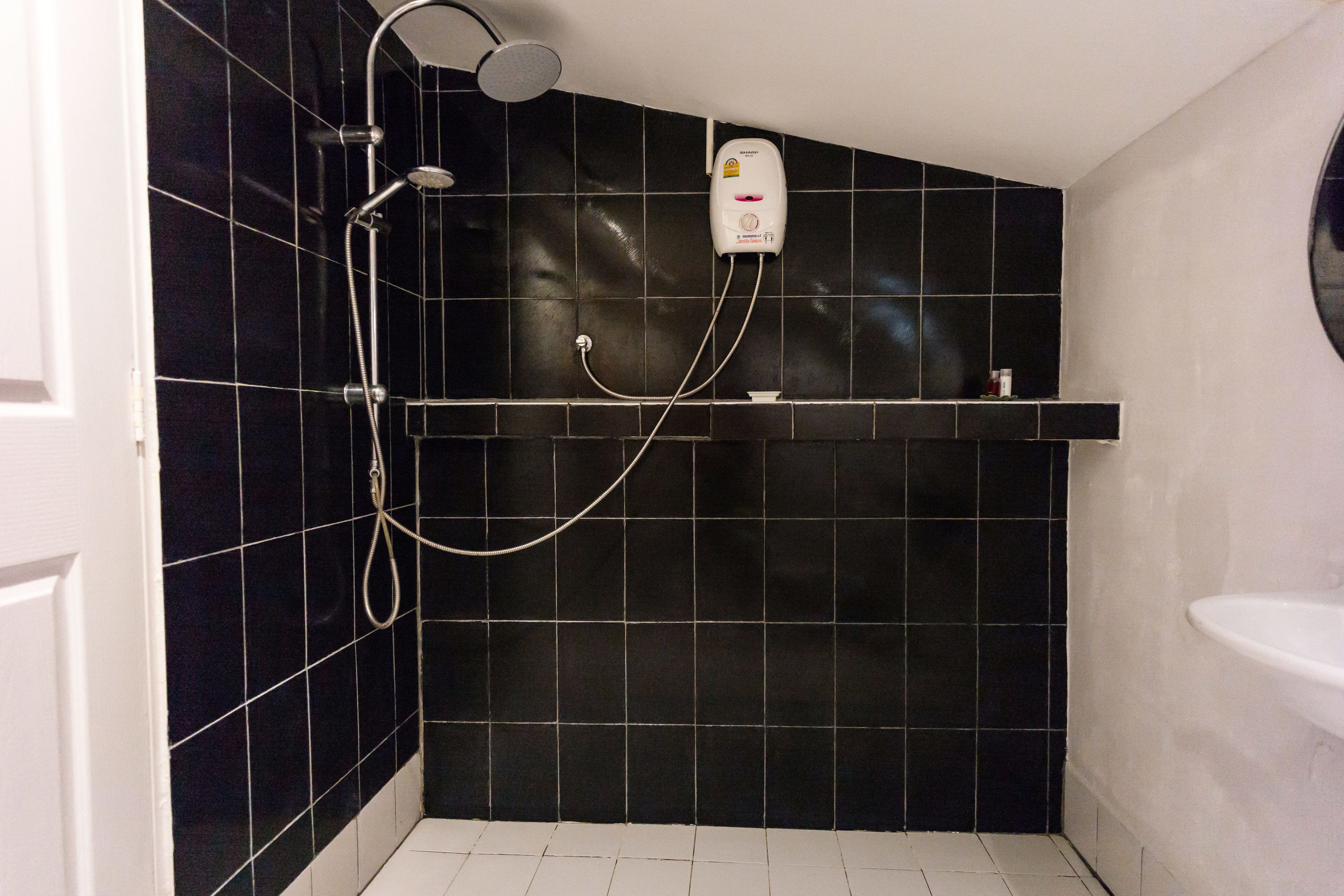 exclusive bungalow, 1 king bed, patio, beachside | bathroom | shower, free toiletries, towels, soap