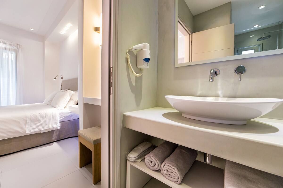 standard double or twin room | bathroom | shower, rainfall showerhead, designer toiletries, hair dryer