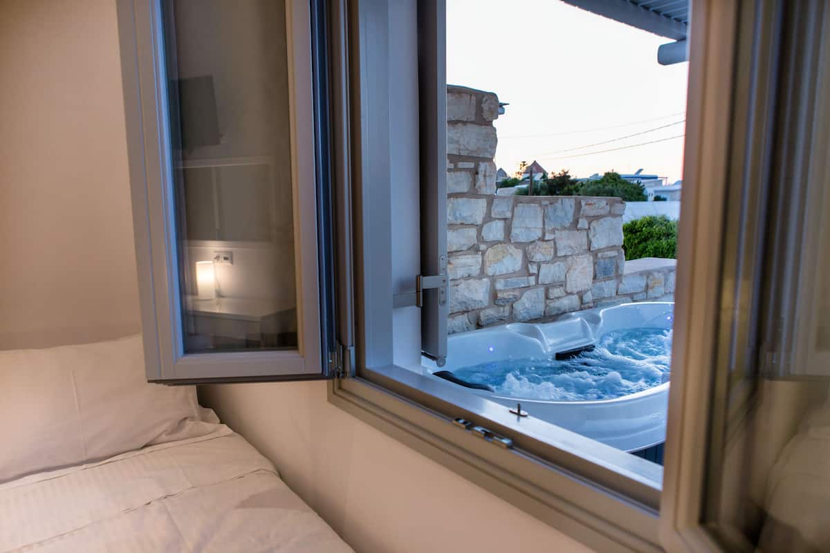 superior suite, 2 bedrooms, jetted tub | desk, soundproofing, iron/ironing board, cots/infant beds