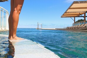 Outdoor pool, open 8:00 AM to 8:00 PM, pool loungers