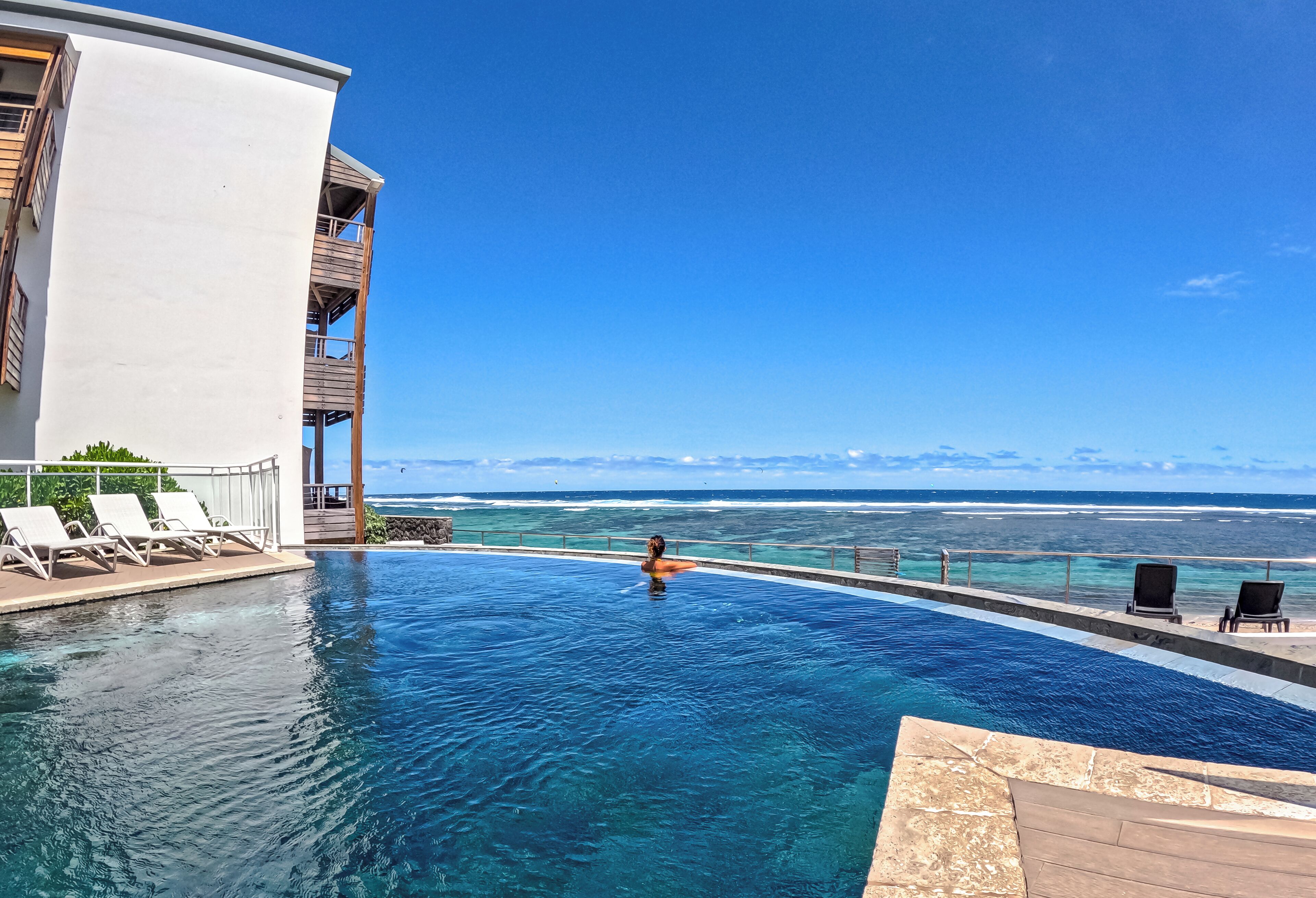 outdoor pool, open 8:00 am to 8:00 pm, pool loungers