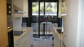 Apartment, 2 Bedrooms | Private kitchen | Fridge, microwave, stovetop, dishwasher