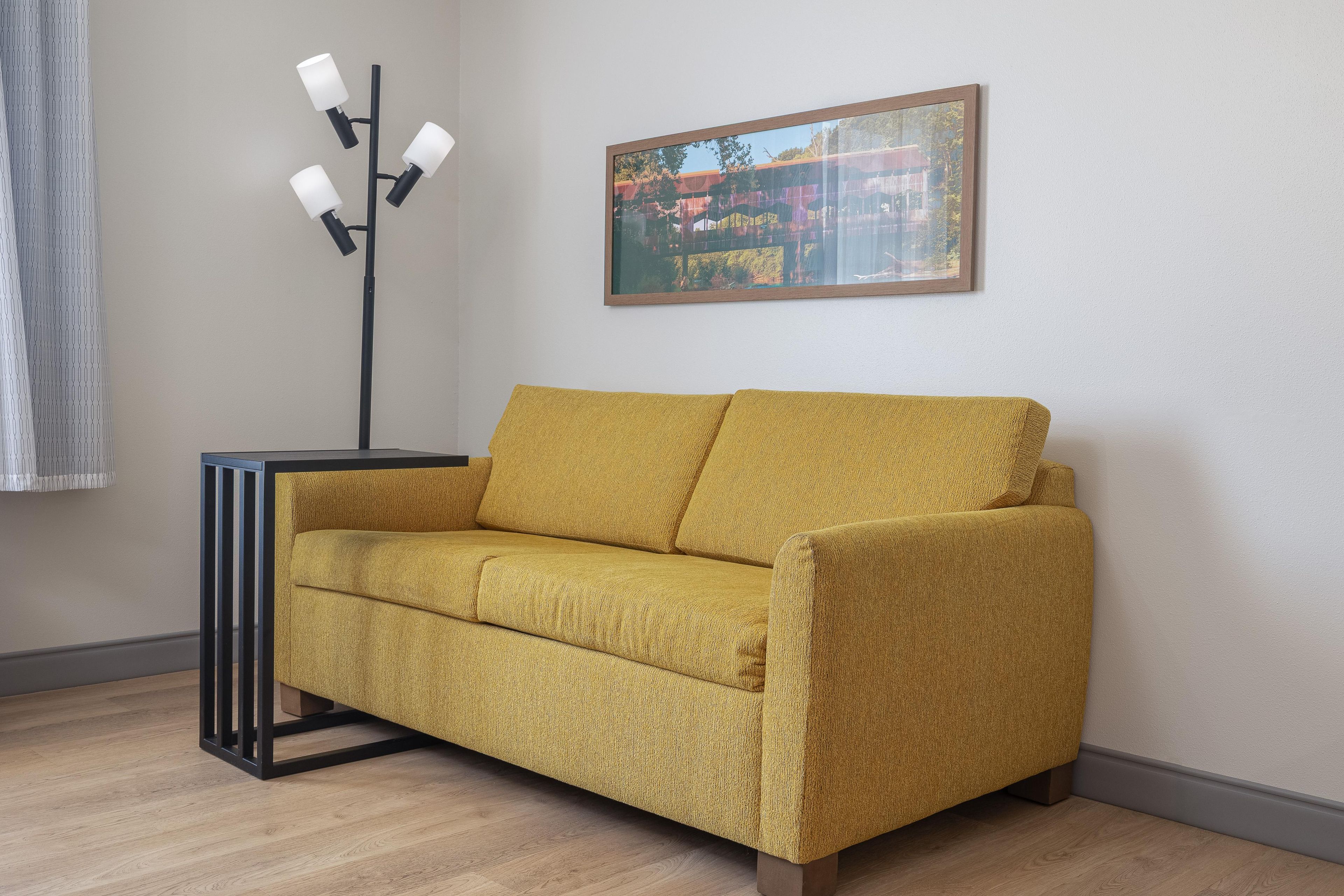 Room, 1 King Bed with Sofa bed, Non Smoking, Refrigerator | Living area | Flat-screen TV