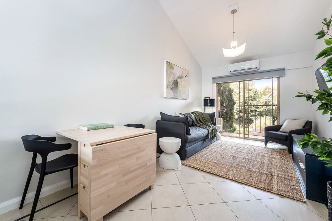 1 Bed Apartment | Living area | 32-inch TV with digital channels