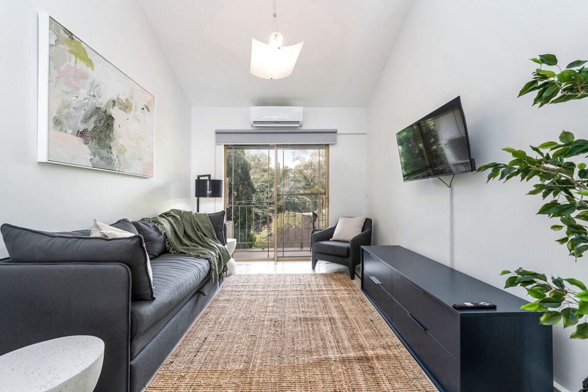 1 Bed Apartment | Living area | 32-inch TV with digital channels