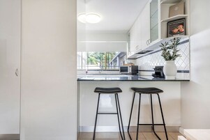 1 Bed Apartment | Living area | 32-inch TV with digital channels