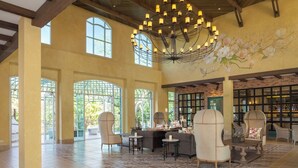A spacious interior with high ceilings, large windows, and a chandelier. - U Khao Yai (Pak Chong)