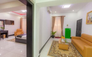 Deluxe Suite | Living area | Flat-screen TV