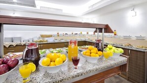 A buffet setup with various fruits, juices, and dishes. - Grand Eyuboglu Hotel (Istanbul)