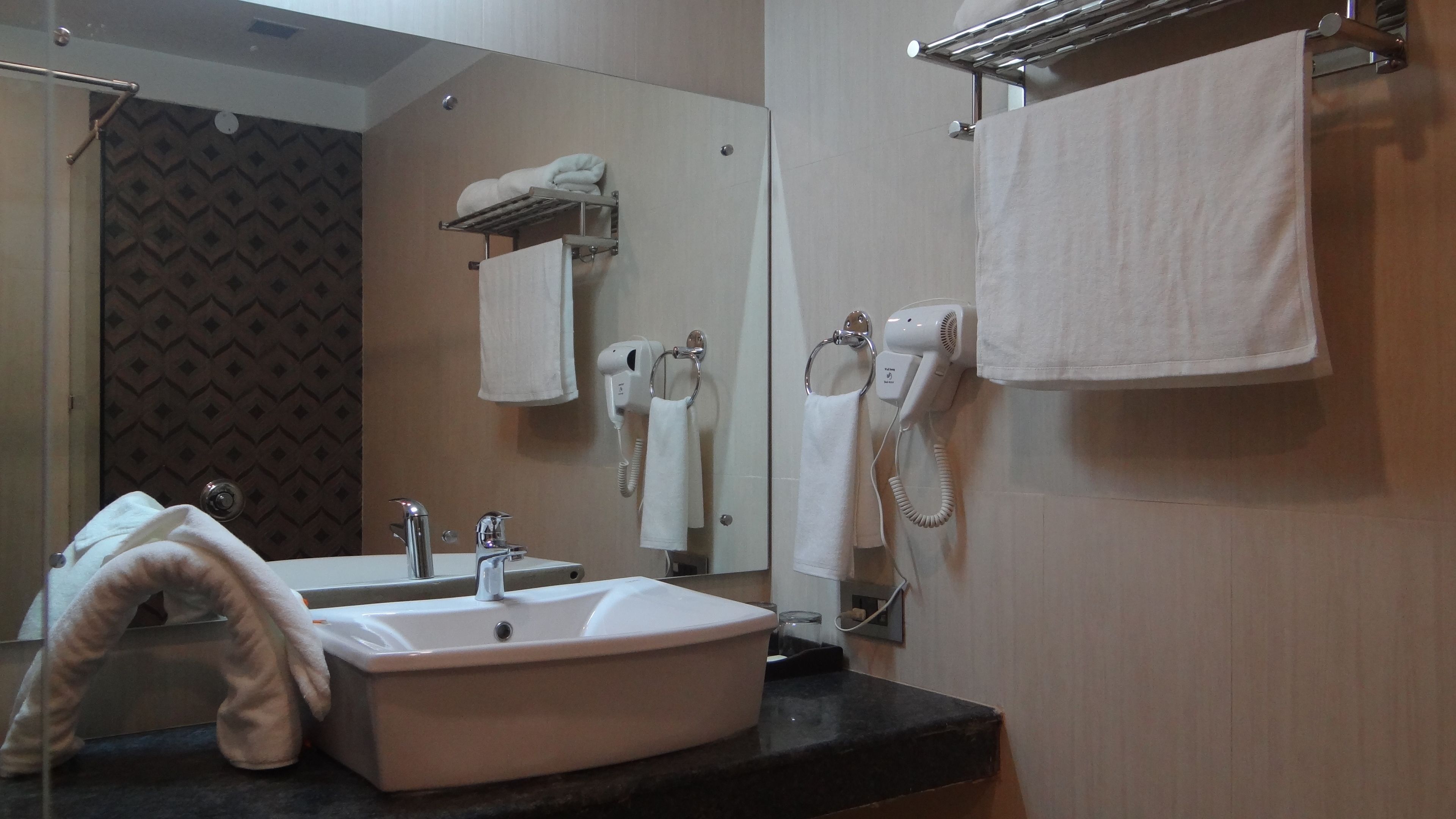 premier double room, 1 queen bed, non smoking, city view | bathroom | shower, free toiletries, hair dryer, bathrobes