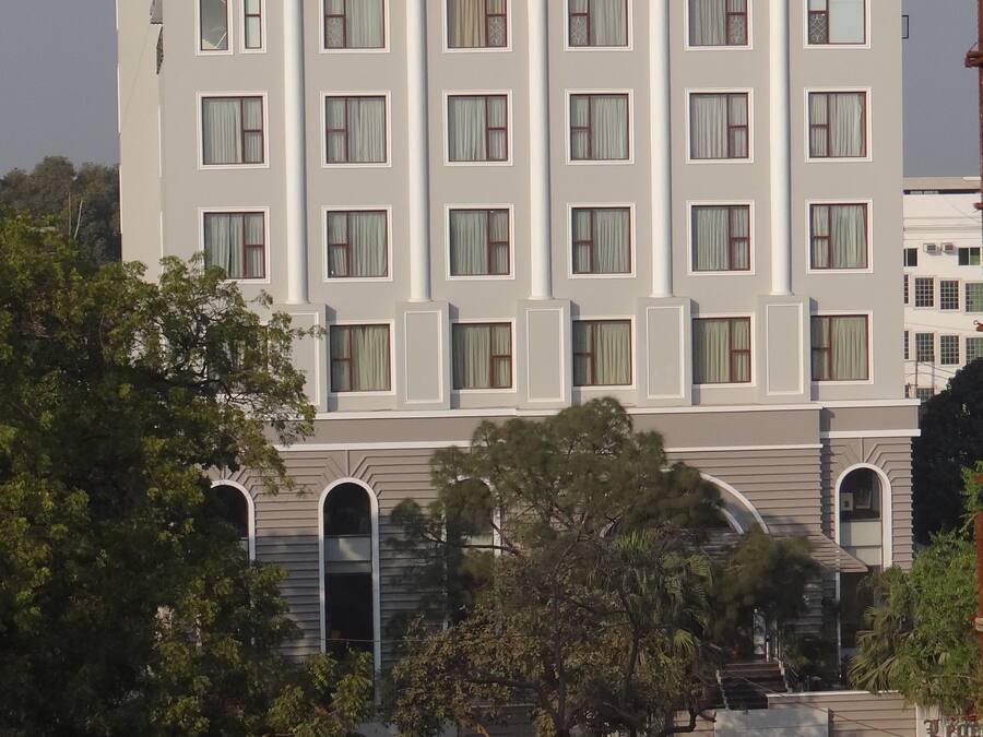 A multi-story hotel with a prominent sign reading "The Legend Hotel".