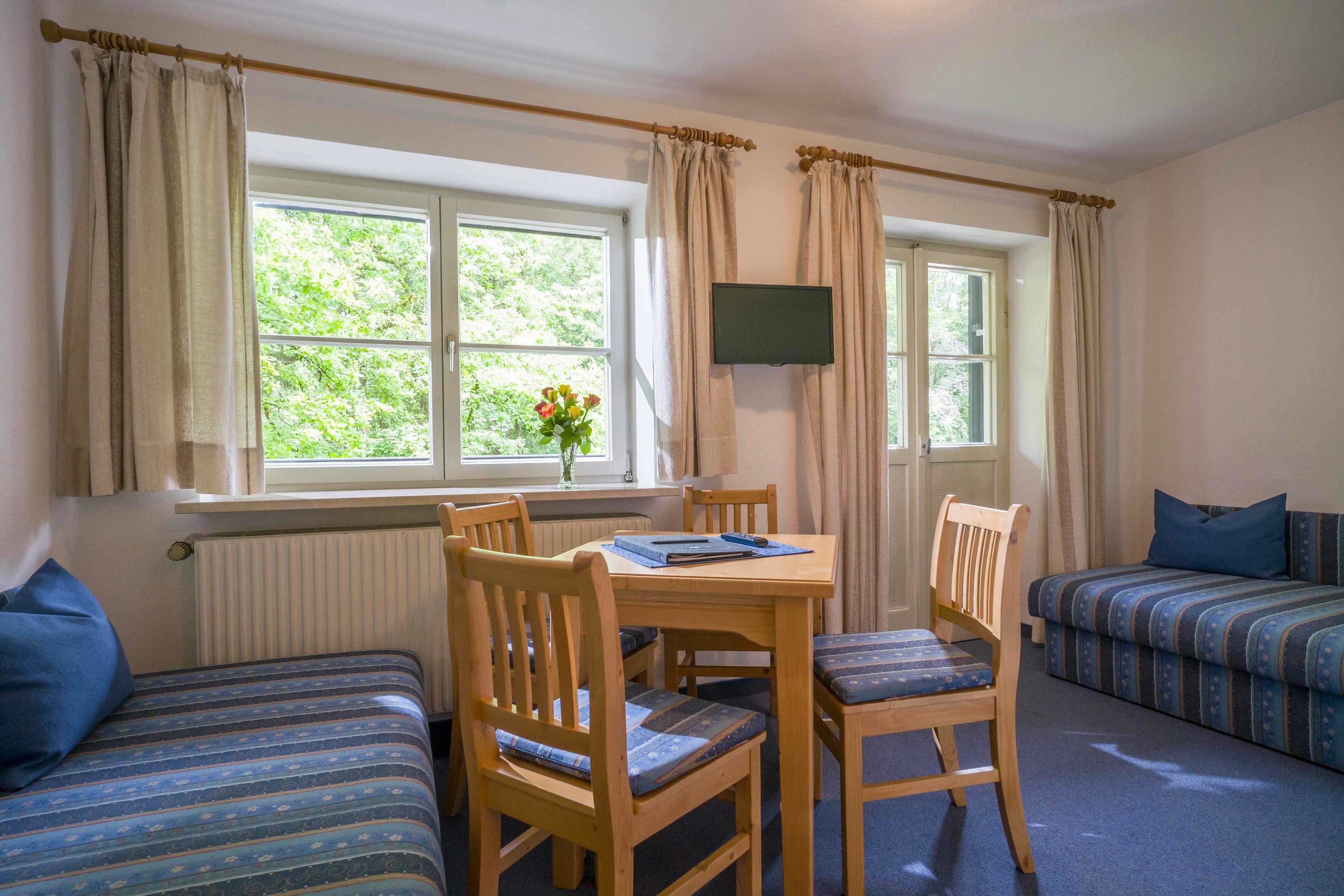 family room, balcony | living area | flat-screen tv