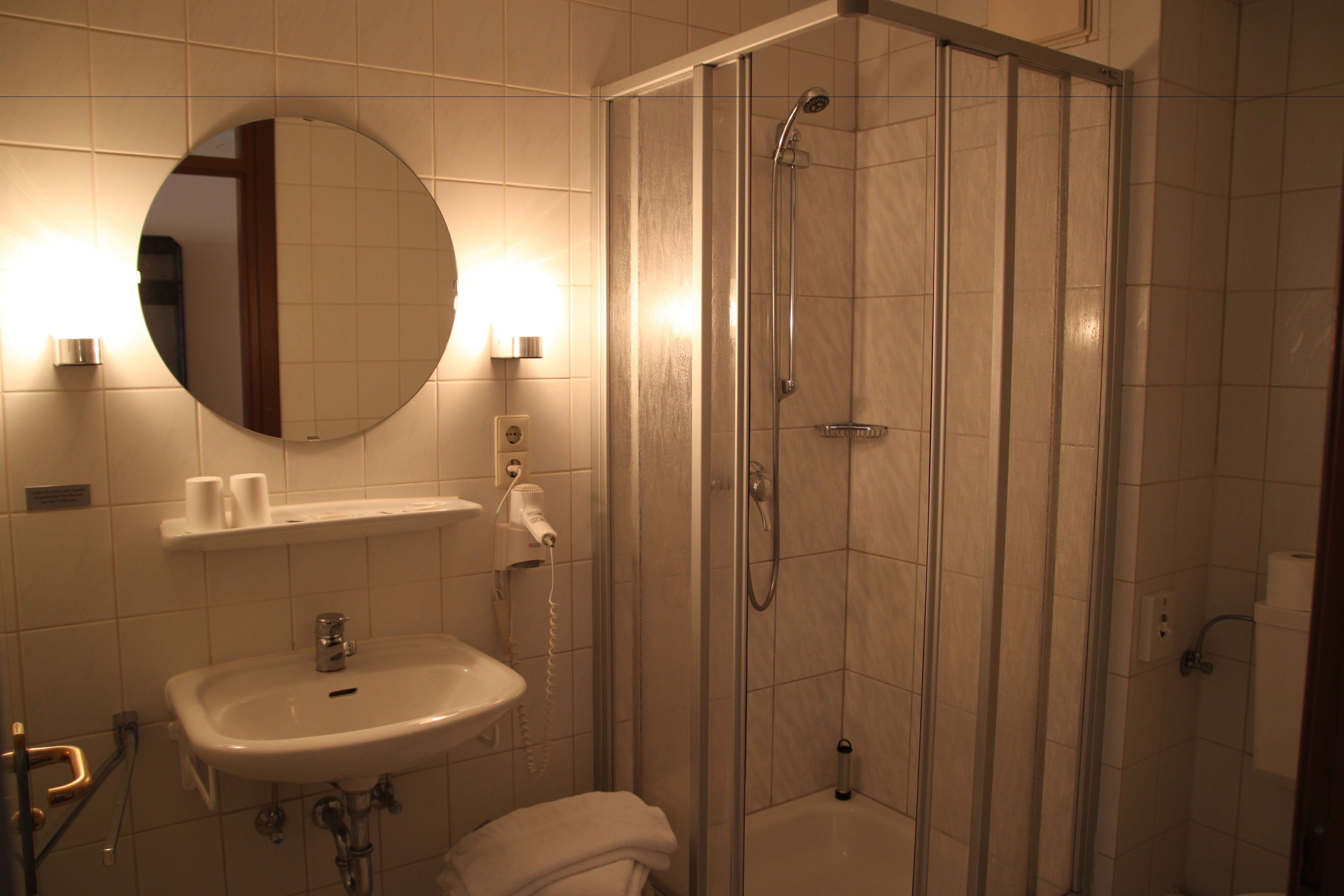 eco-friendly toiletries, hair dryer, towels