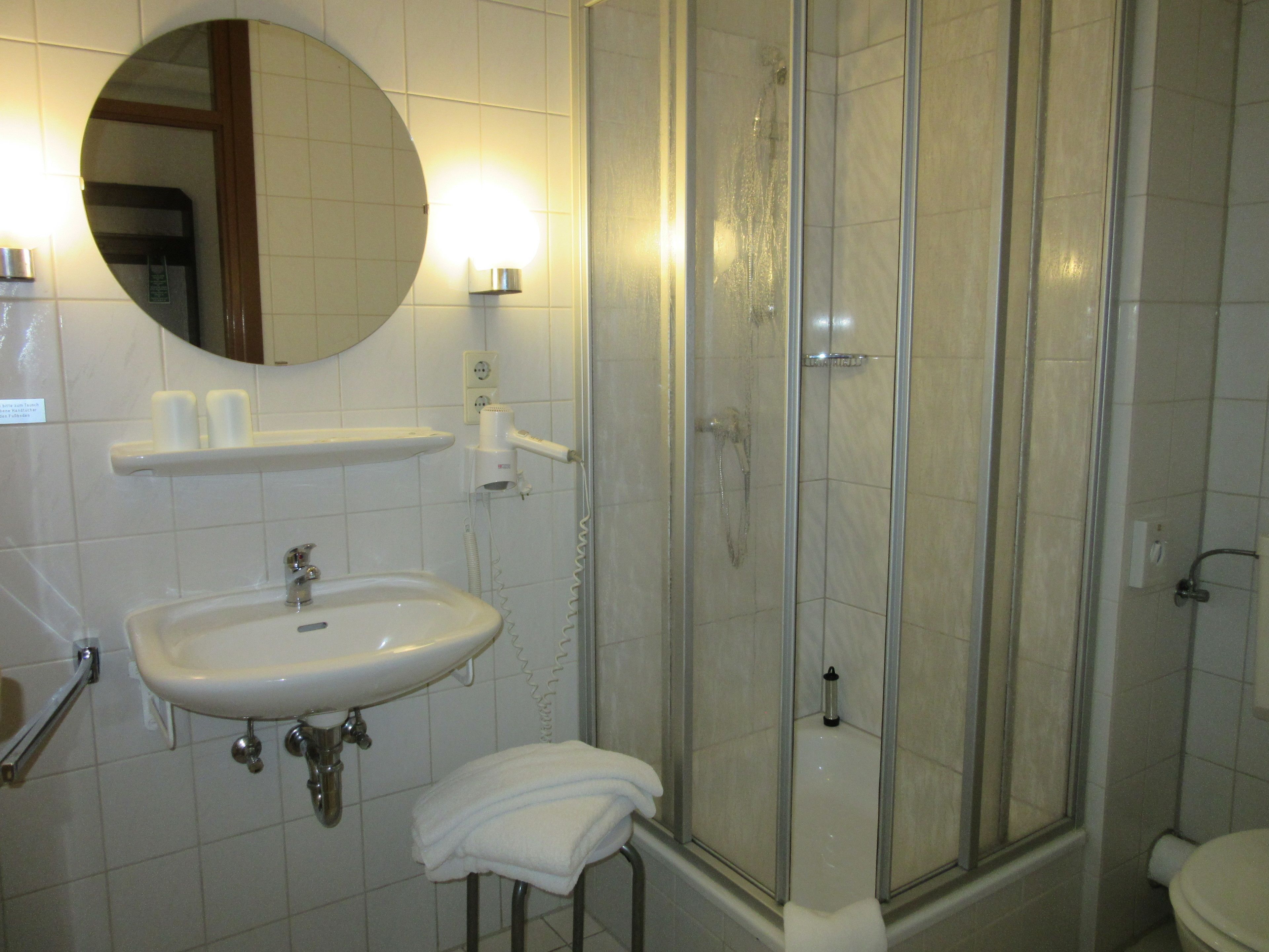 eco-friendly toiletries, hair dryer, towels