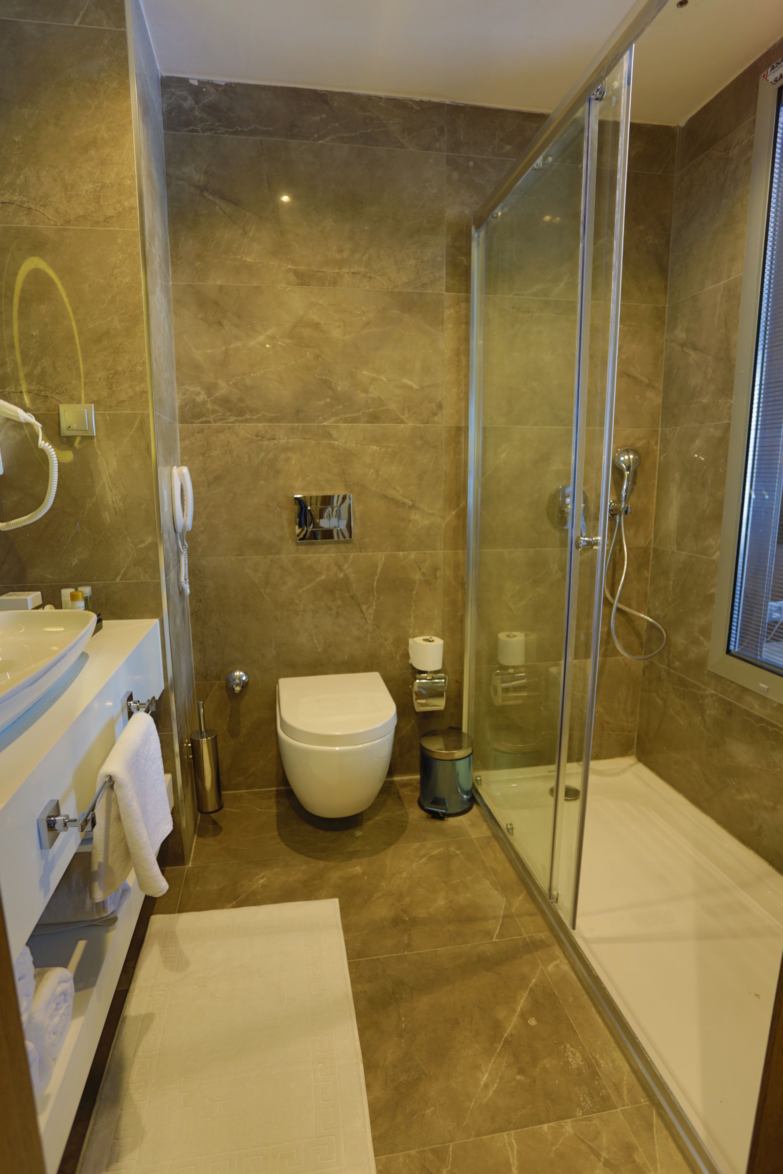 deluxe standard room | bathroom | shower, free toiletries, hair dryer, slippers