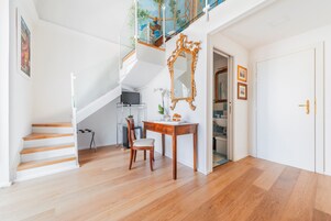 Deluxe Room, Balcony | Living room | Flat-screen TV