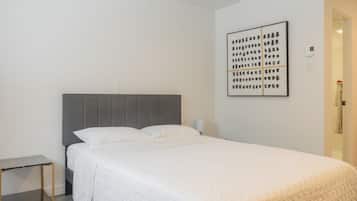 Premium bedding, memory-foam beds, desk, laptop workspace