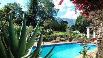 Outdoor pool, pool umbrellas, sun loungers