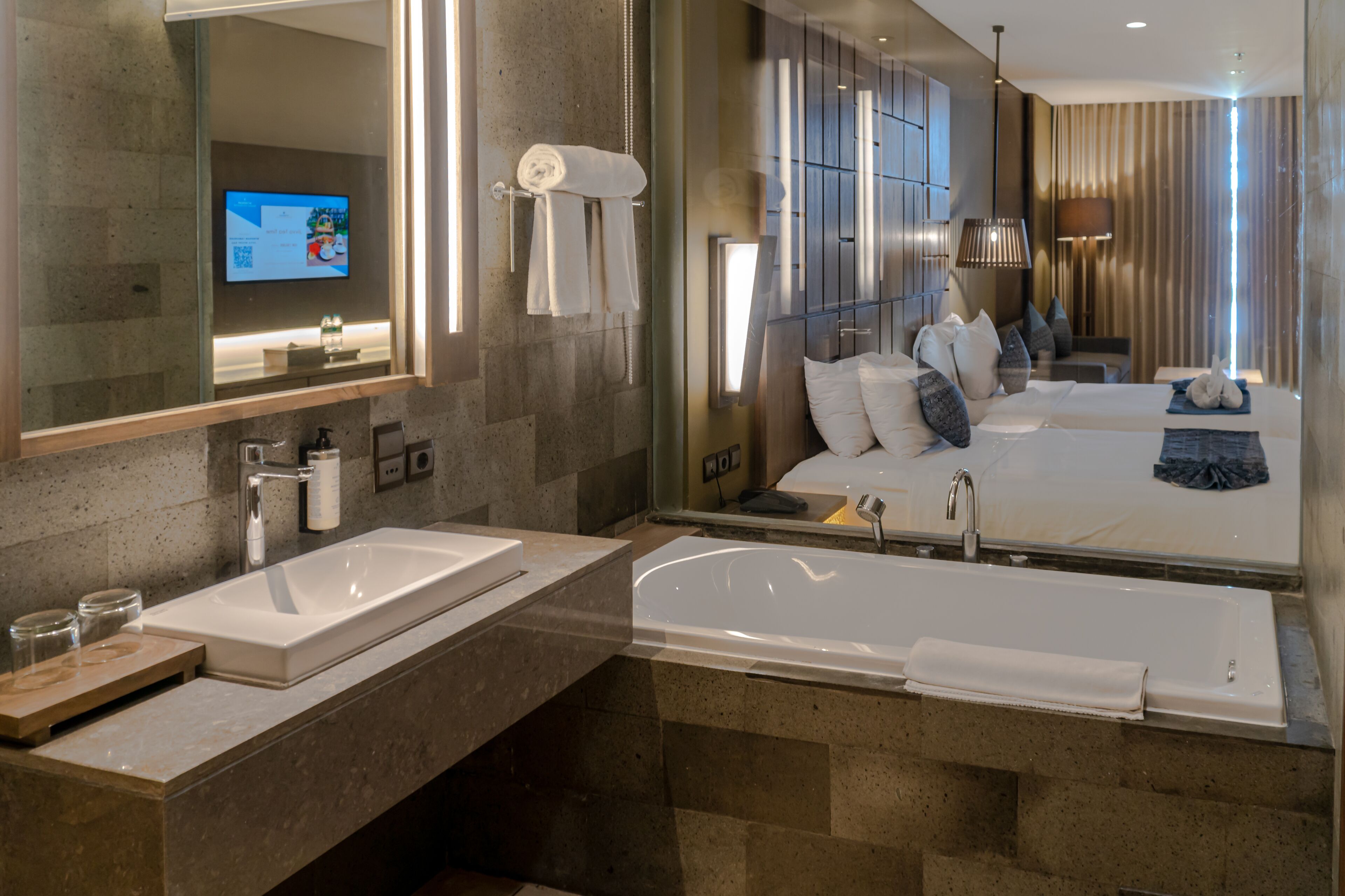 designer toiletries, hair dryer, bathrobes, slippers