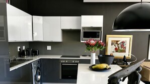 Coffee/tea maker, fridge, microwave, oven