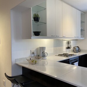 Superior Apartment, 2 Bedrooms | Private kitchen | Fridge, microwave, oven, stovetop