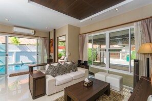 Deluxe Villa, 3 Bedrooms | Living room | 60-inch flat-screen TV with cable channels, LED TV - The Ville Pool Villa Jomtien (Pattaya)