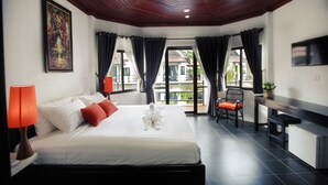 A hotel room with a bed, a desk, a chair, and a TV. - SR Sofia Villa Hotel (Siem Reap)