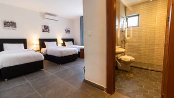 Deluxe Triple Room, 3 Twin Beds, City View | Bathroom | Shower, hydromassage showerhead, free toiletries, hair dryer