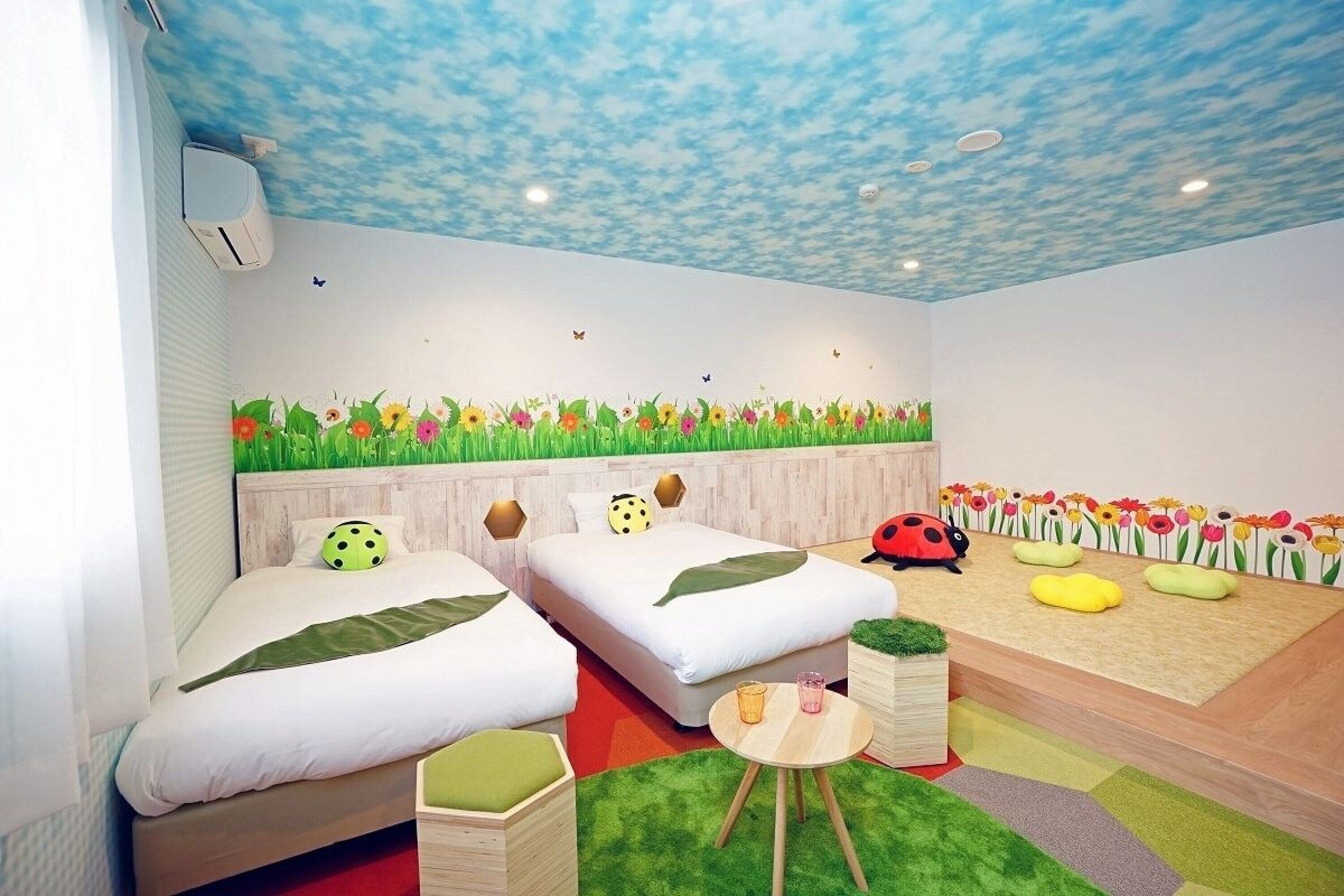 deluxe quadruple room, non smoking | 1 bedroom, down duvets, in-room safe, blackout curtains