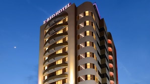 A multi-story hotel with a prominent 'E-RED HOTEL' sign, a modern architectural design, and a well-lit entrance. - E-Red Hotel Sdn Bhd (Kuantan)