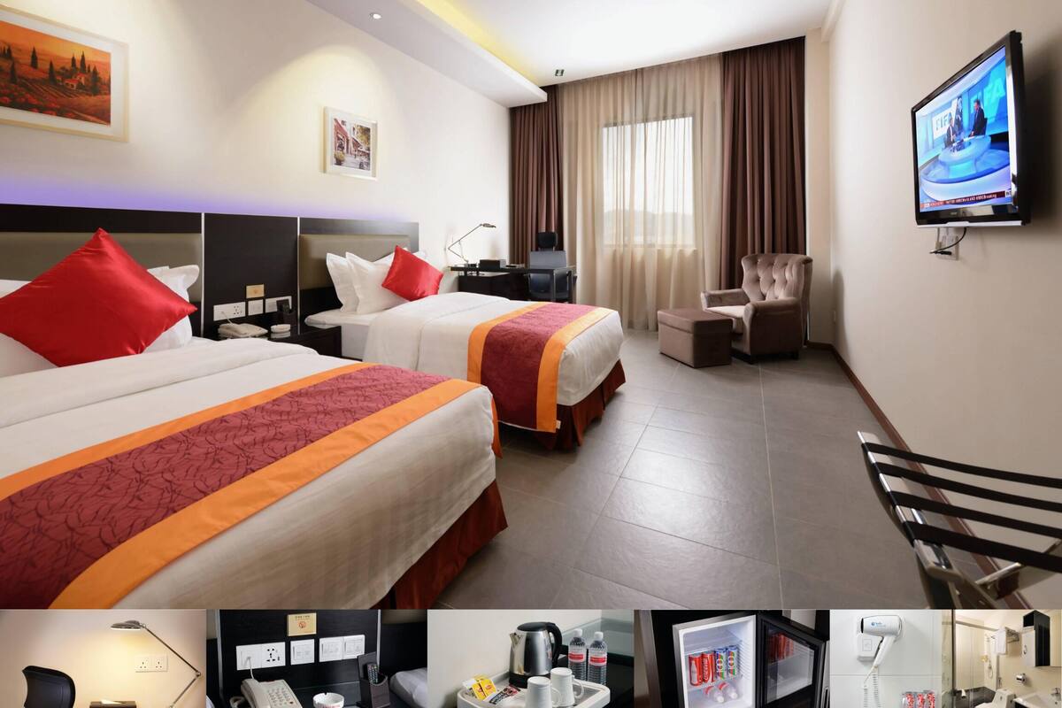 deluxe twin room | minibar, in-room safe, desk, iron/ironing board