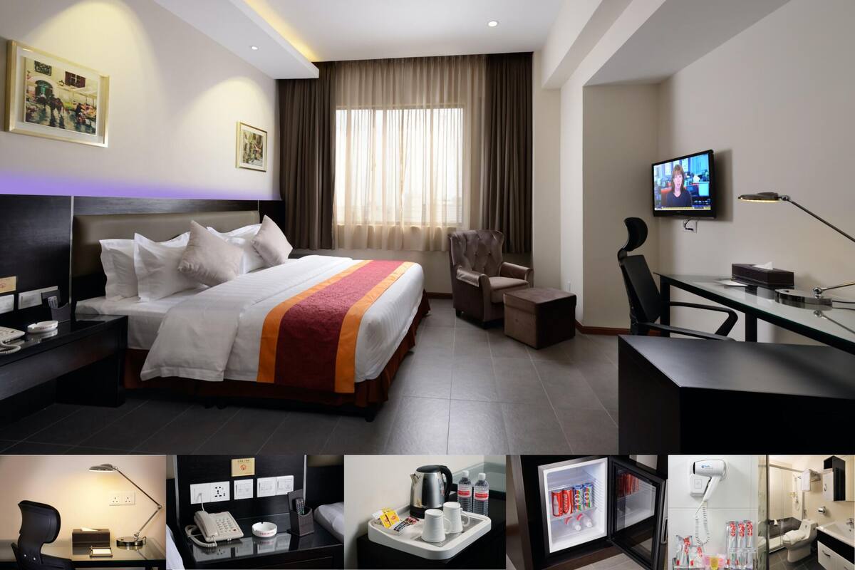 Rom – deluxe, 1 kingsize-seng | Minibar, safe på rommet, skrivebord og strykejern/-brett