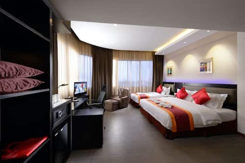 Family Room | Minibar, in-room safe, desk, iron/ironing board