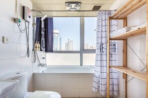 Economy Studio | Bathroom | Free toiletries, hair dryer, slippers, towels - Lacasa Service Apartment (Beijing)