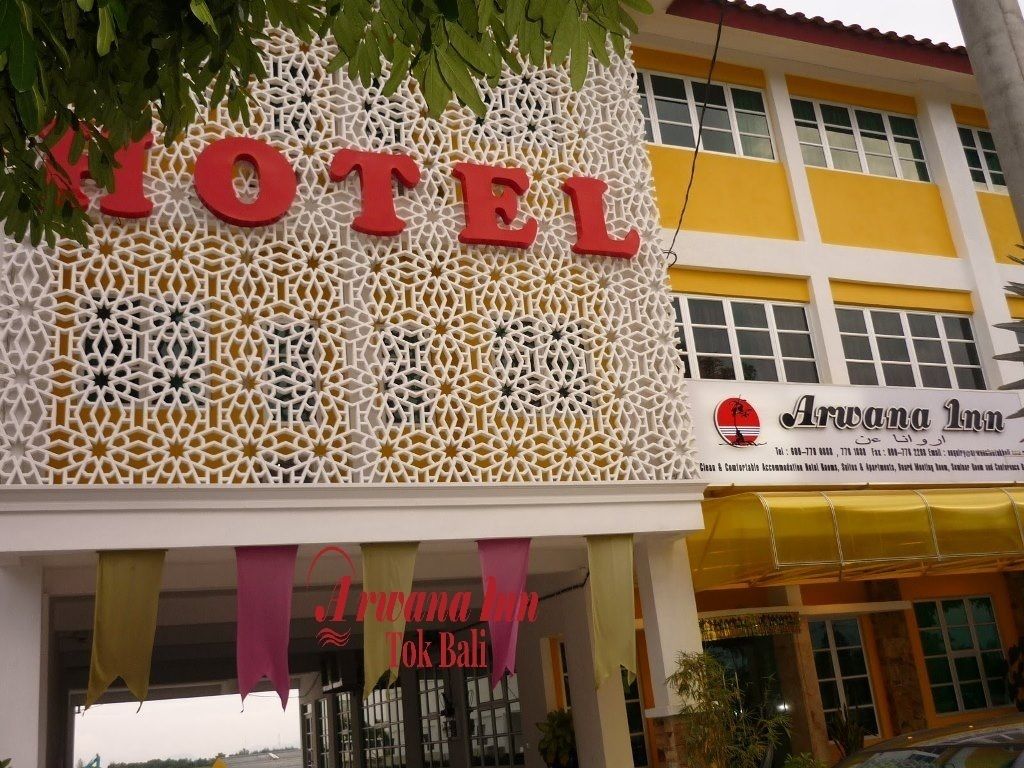 A hotel sign with a geometric pattern and the name "HOTEL" in large letters.