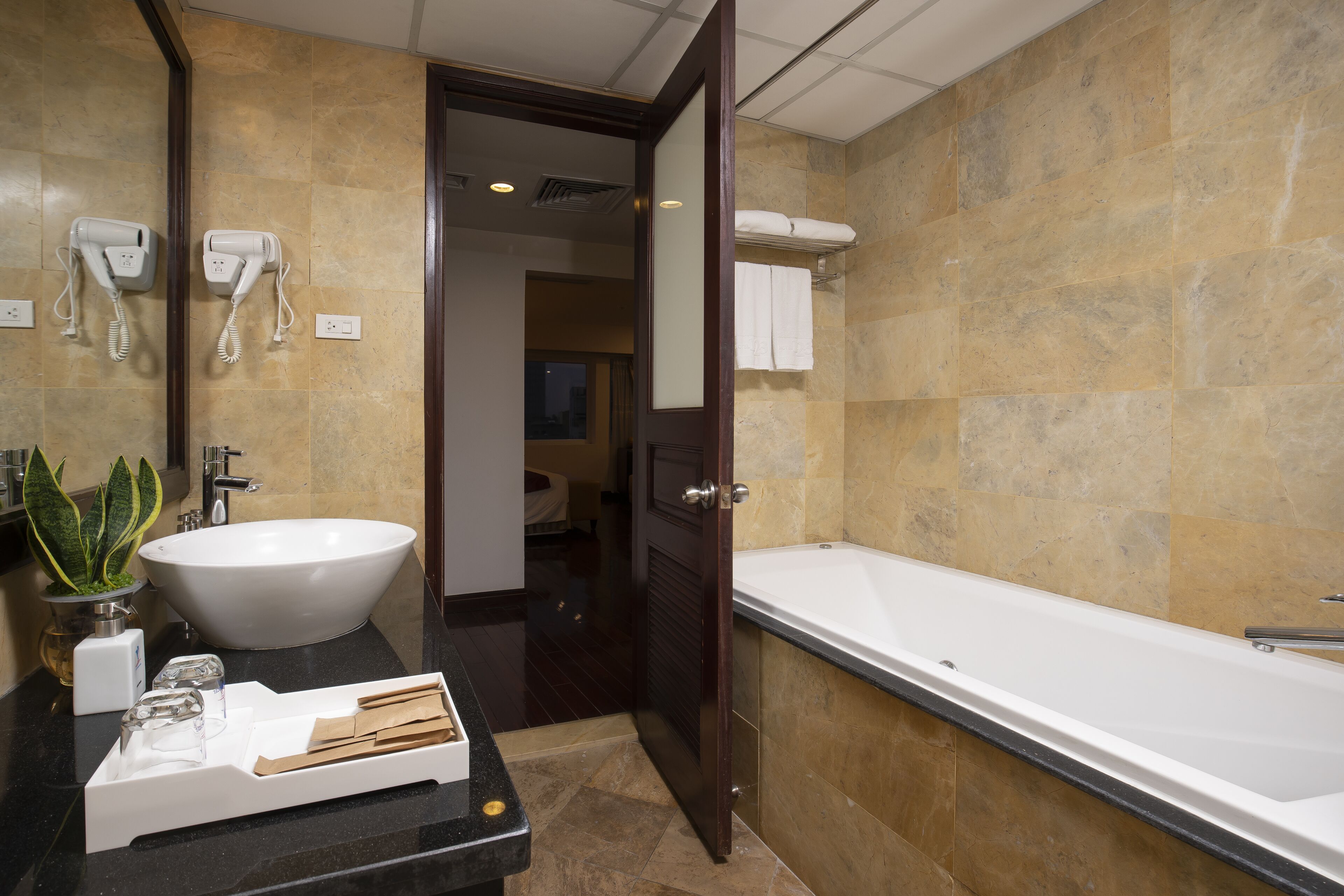 junior suite | bathroom | free toiletries, hair dryer, slippers, towels
