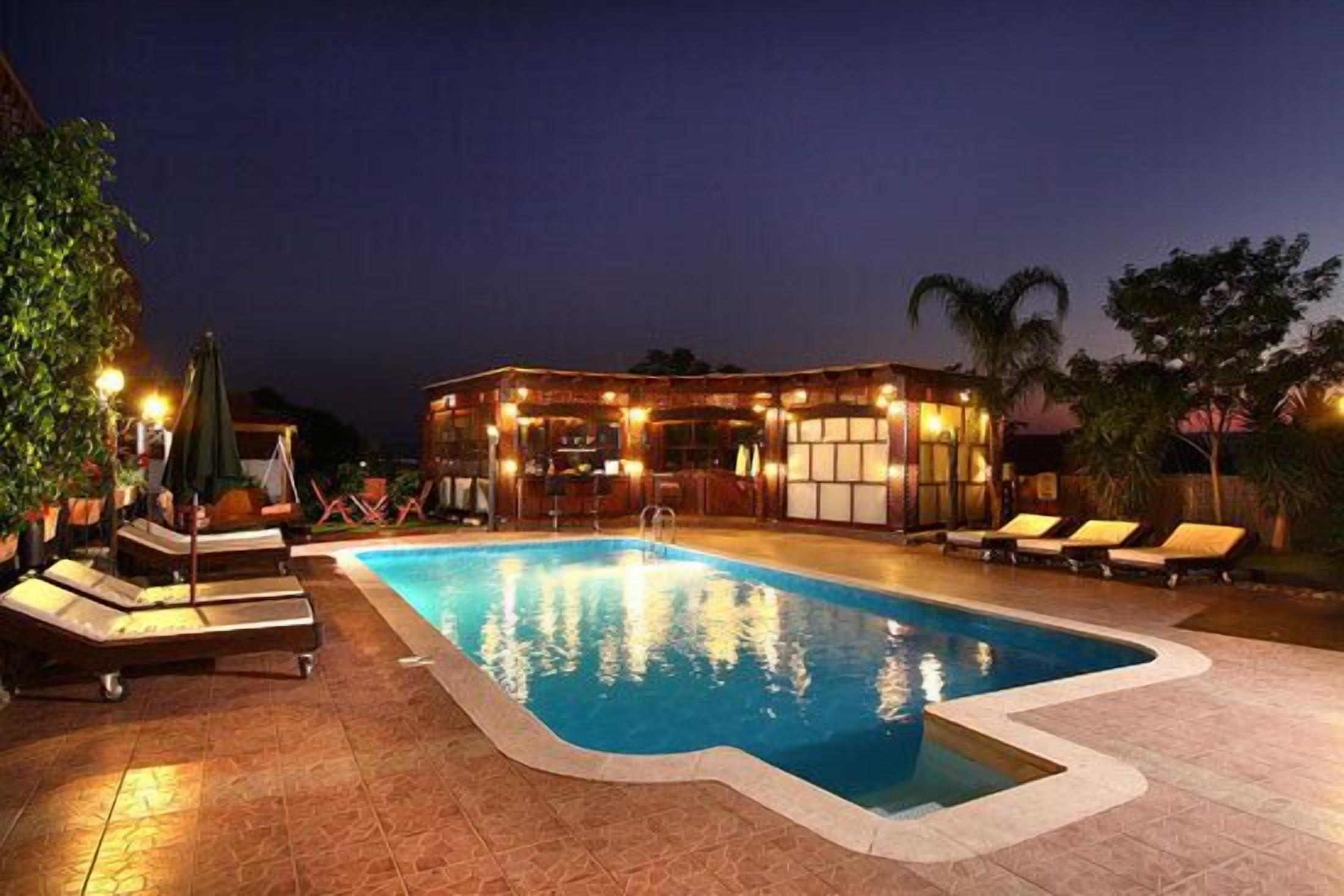 Outdoor pool, pool umbrellas, sun loungers