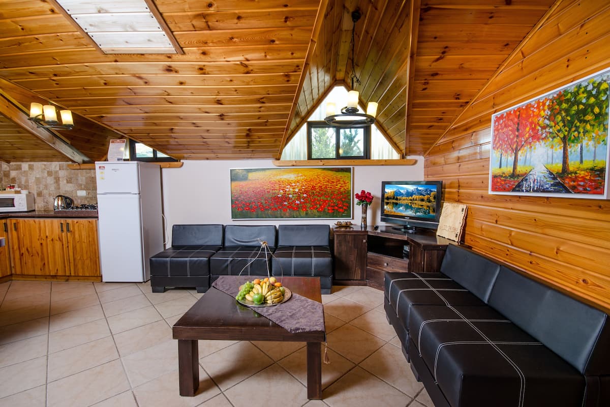 Deluxe Suite, 3 Bedrooms | Living room | Flat-screen TV