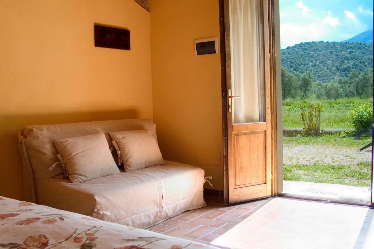 Habitació quàdruple familiar, zona enjardinada | Vista des de l'habitació
