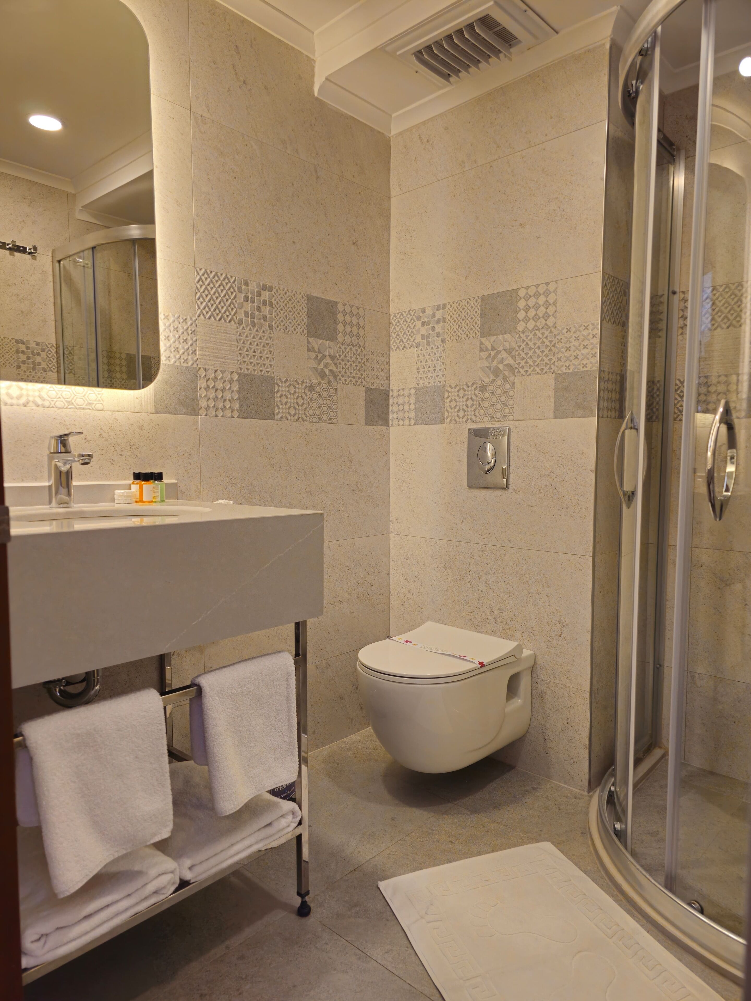 shower, free toiletries, hair dryer, towels