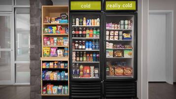 A refrigerated display with sections labeled 'cold' and 'really cold', containing various beverages and snacks.