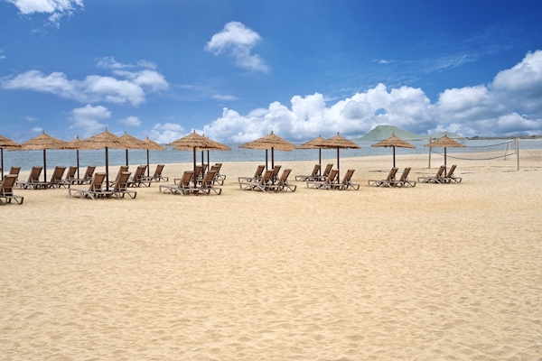 On the beach, sun loungers, beach umbrellas, beach towels