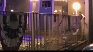 A motel sign with neon lights, a balcony, and a gated entrance. - Isle of Capri Motel (North Wildwood)